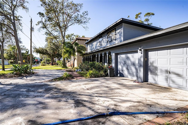 view of property exterior featuring a garage