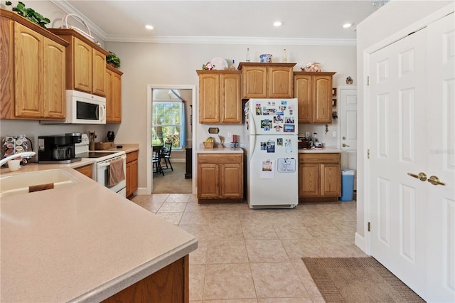 kitchen with crown molding, white appliances, light tile patterned flooring, and sink