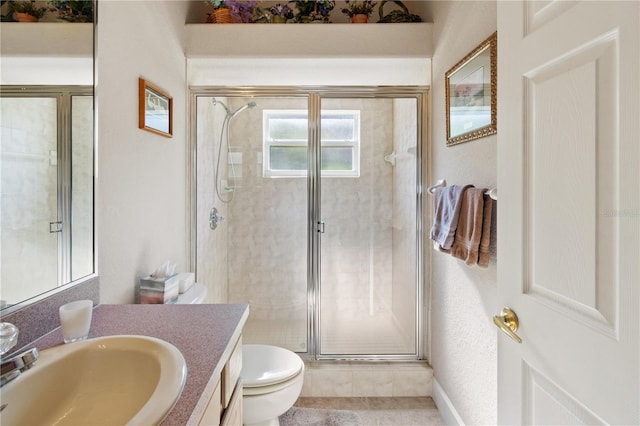 bathroom with vanity, toilet, and walk in shower