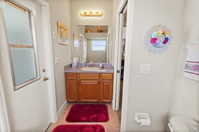 bathroom featuring vanity and toilet