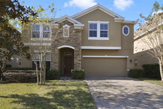 view of front facade featuring a front yard and a garage