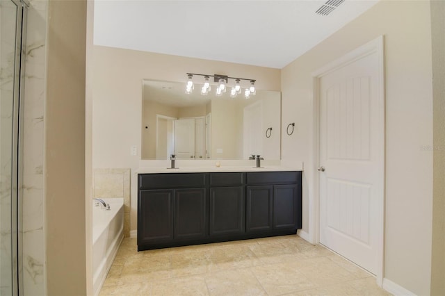 bathroom with a bath and vanity