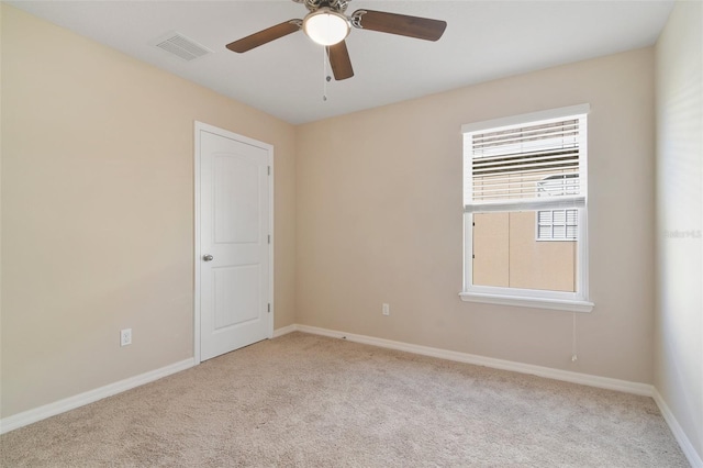 carpeted empty room with ceiling fan