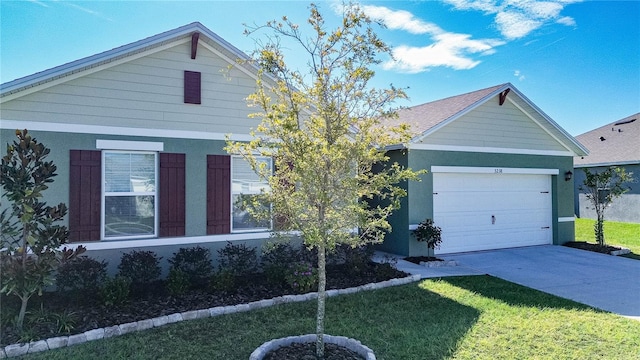 view of front of home featuring a garage and a front lawn