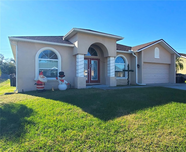 single story home with a garage and a front yard