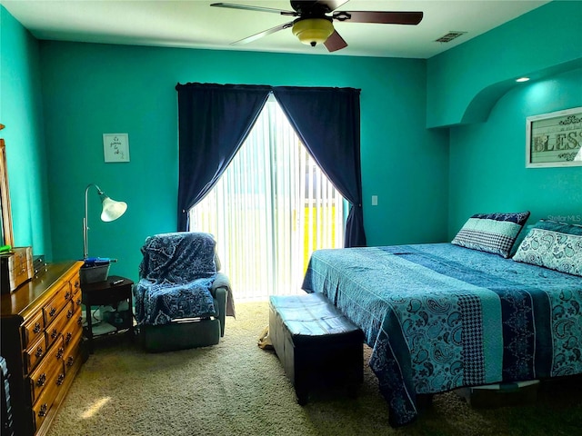 carpeted bedroom featuring ceiling fan