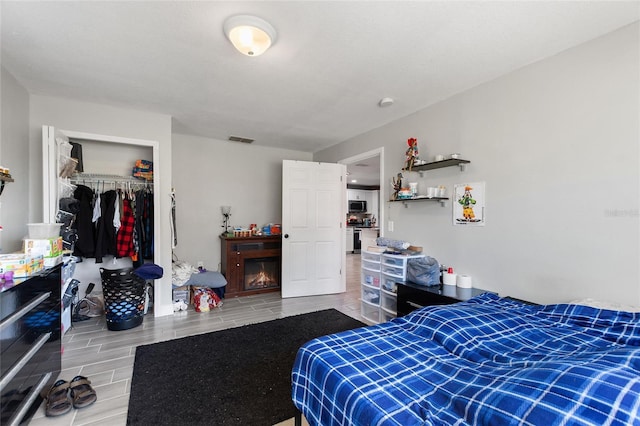 bedroom with a closet and hardwood / wood-style flooring