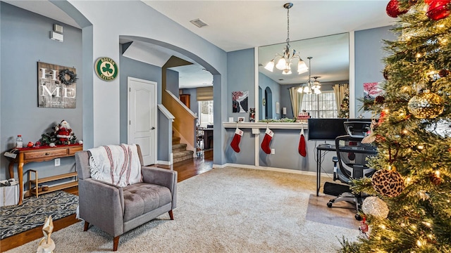 office area featuring carpet and a notable chandelier