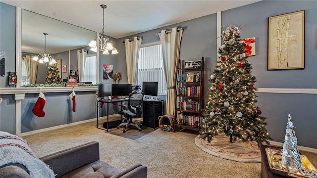 home office featuring carpet and a notable chandelier