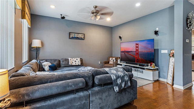 living room with hardwood / wood-style floors and ceiling fan