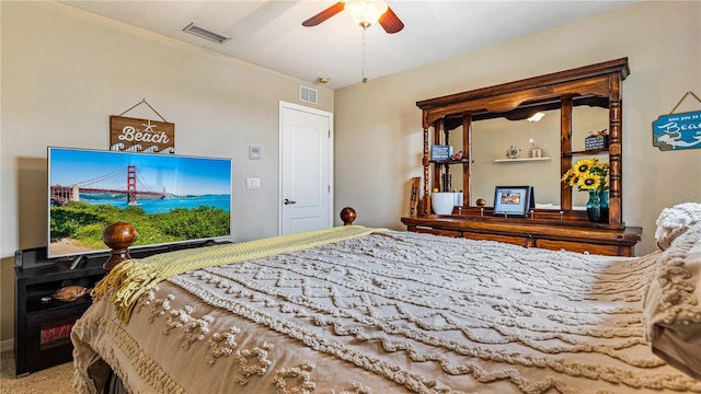 bedroom featuring ceiling fan and carpet