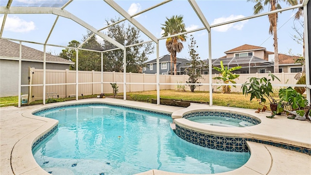 view of swimming pool featuring a lanai, a patio, and an in ground hot tub