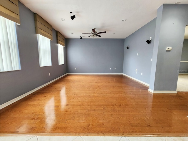 spare room featuring ceiling fan and light wood-type flooring