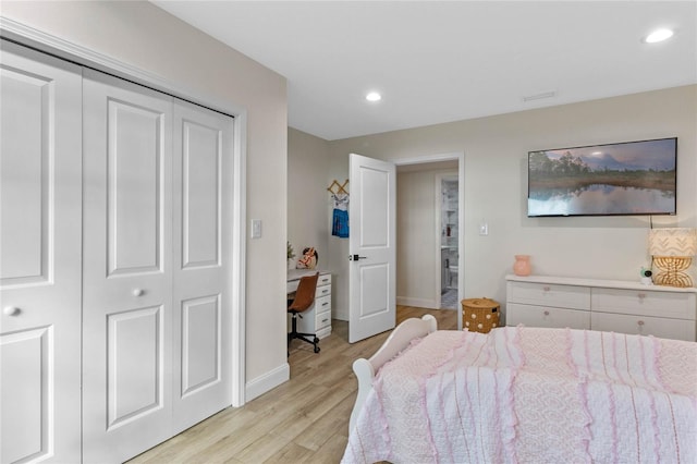 bedroom featuring a closet and light hardwood / wood-style flooring