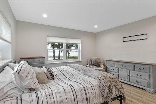 bedroom with light hardwood / wood-style flooring