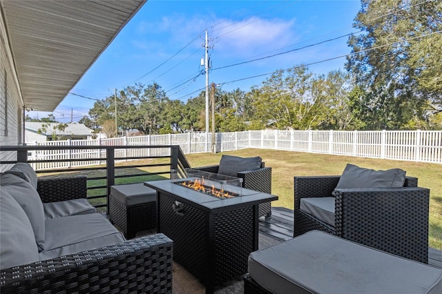 deck with a lawn and an outdoor fire pit