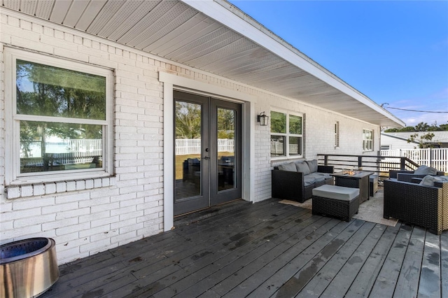 deck with an outdoor living space and french doors