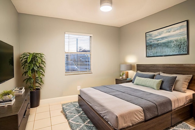 bedroom with light tile patterned floors