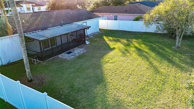 view of yard with a sunroom