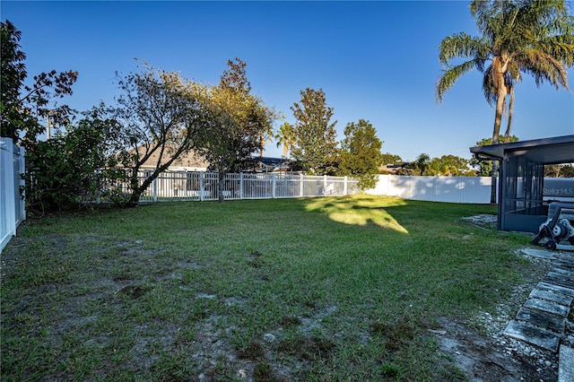 view of yard featuring a sunroom