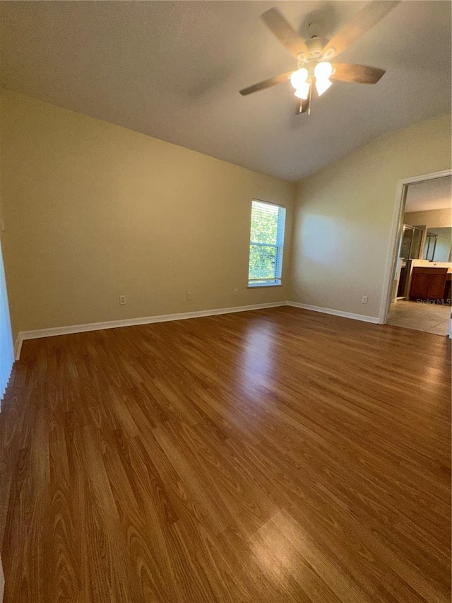 spare room featuring dark hardwood / wood-style floors and ceiling fan