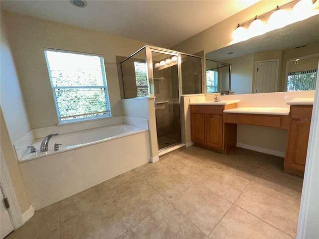 bathroom with tile patterned flooring, vanity, and independent shower and bath