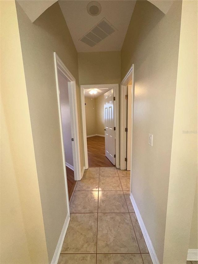 corridor featuring light tile patterned flooring