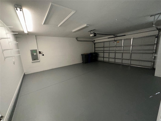 garage featuring a garage door opener and electric panel