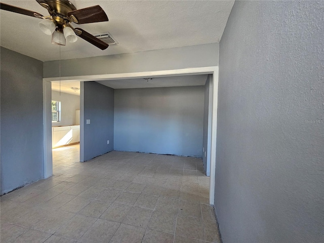 spare room with ceiling fan