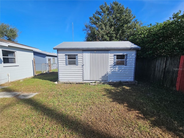 view of outdoor structure with a yard