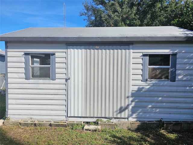 view of property exterior featuring an outdoor structure