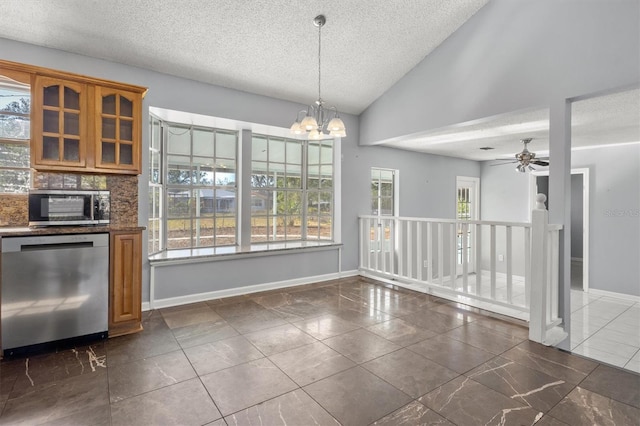 unfurnished dining area featuring ceiling fan with notable chandelier, a textured ceiling, and high vaulted ceiling