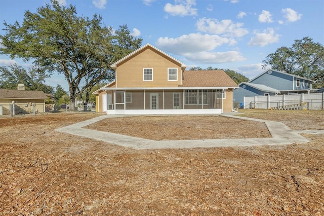 back of house with a sunroom