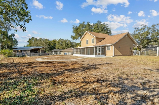 back of property featuring a sunroom