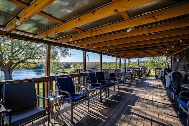 wooden deck featuring a water view