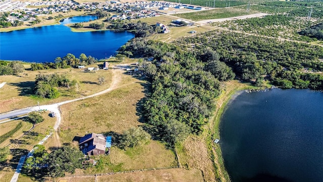 birds eye view of property with a rural view and a water view