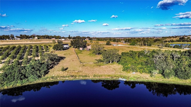 drone / aerial view with a rural view and a water view