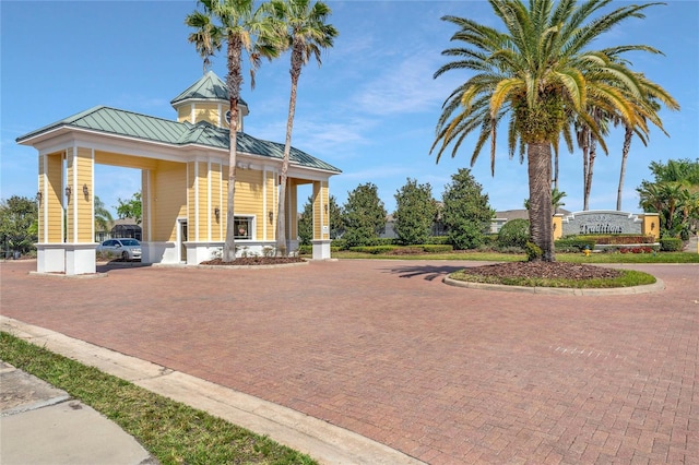 exterior space featuring decorative driveway