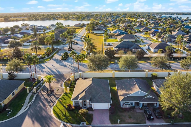 bird's eye view featuring a water view and a residential view