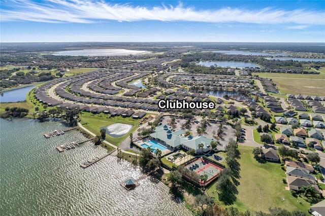 birds eye view of property with a residential view and a water view