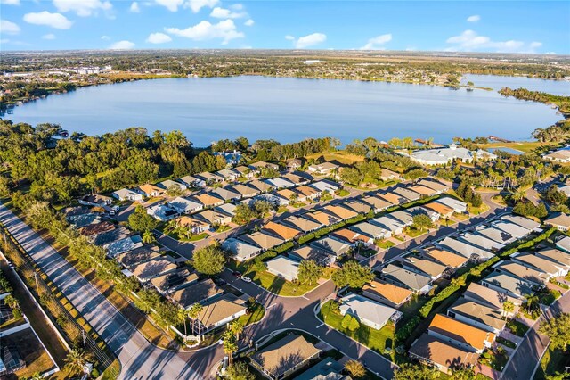 birds eye view of property with a water view and a residential view