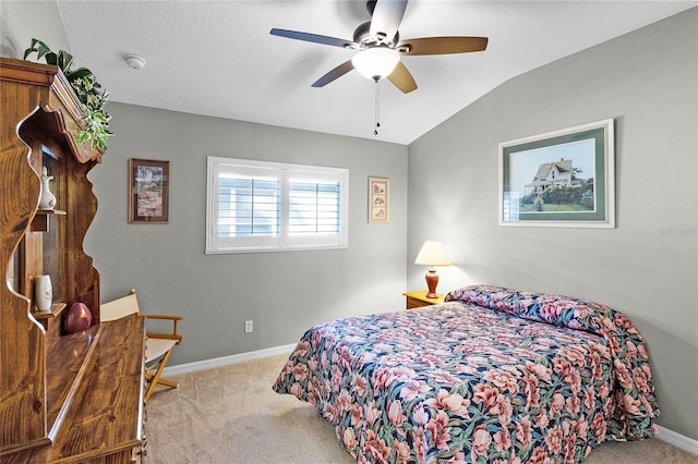 bedroom with lofted ceiling, a ceiling fan, baseboards, and carpet flooring