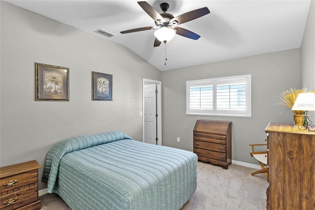 carpeted bedroom with visible vents, vaulted ceiling, baseboards, and ceiling fan