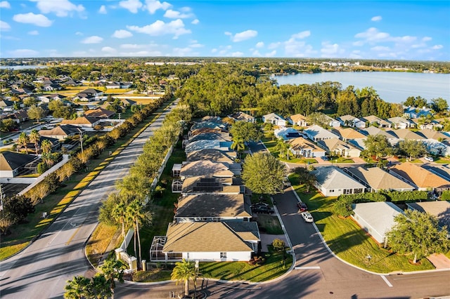 drone / aerial view featuring a water view and a residential view