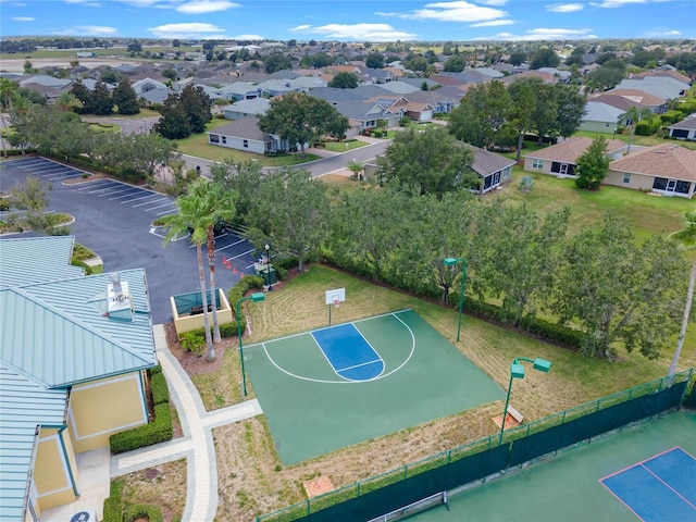 view of sport court with community basketball court, a residential view, and fence