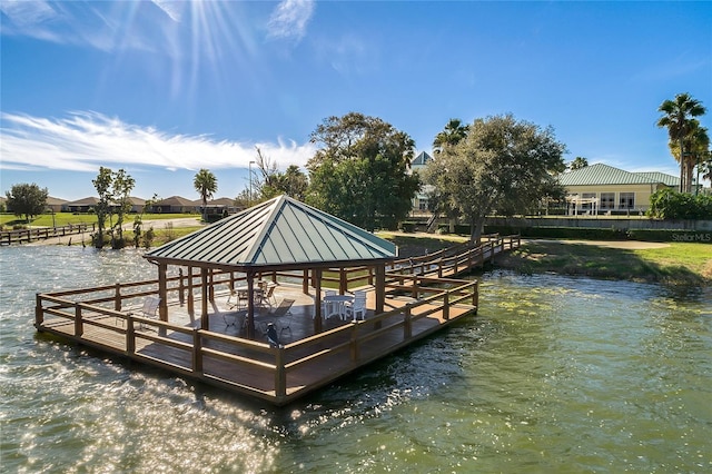 dock area with a gazebo and a water view