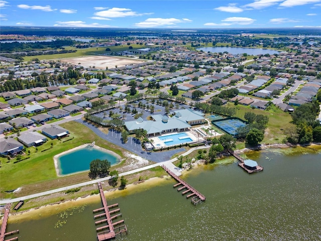 drone / aerial view featuring a water view and a residential view