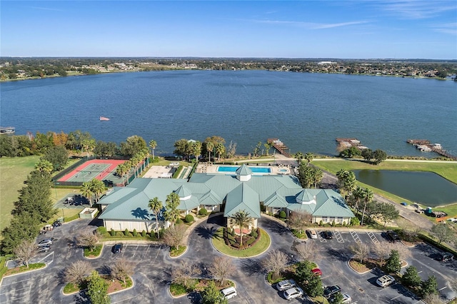 birds eye view of property with a water view