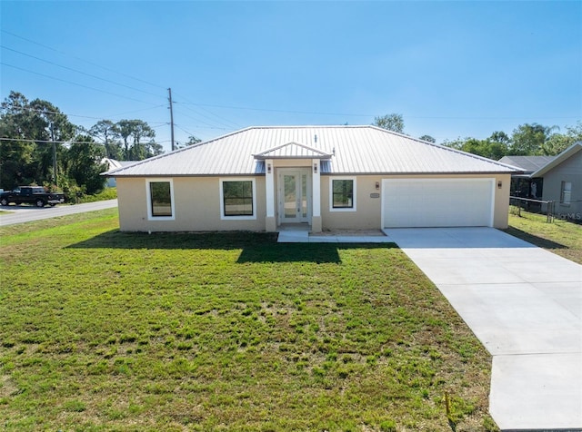 view of front of home featuring a garage and a front lawn