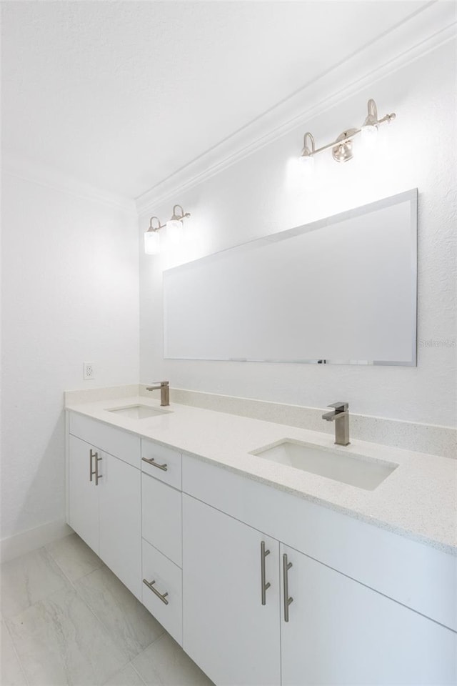 bathroom with vanity and ornamental molding